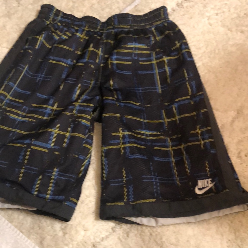 Nike Reversible Swim Shorts  I’m gonna say they’re a Boys 18-20. Or a Mens Small